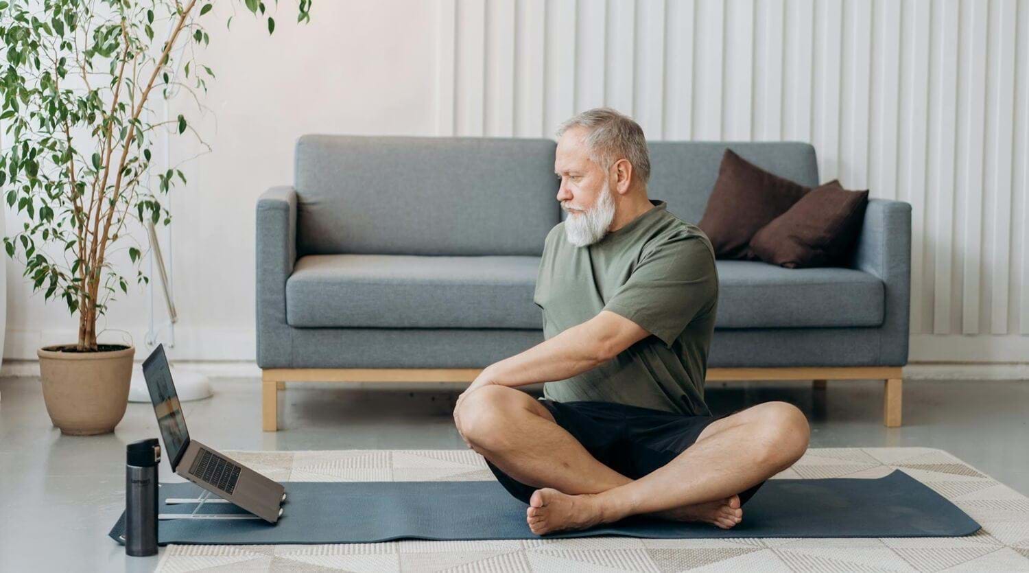 Man doing home workout on a yoga mat