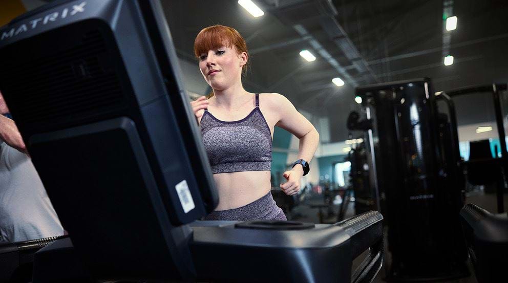 Lady running a treadmill